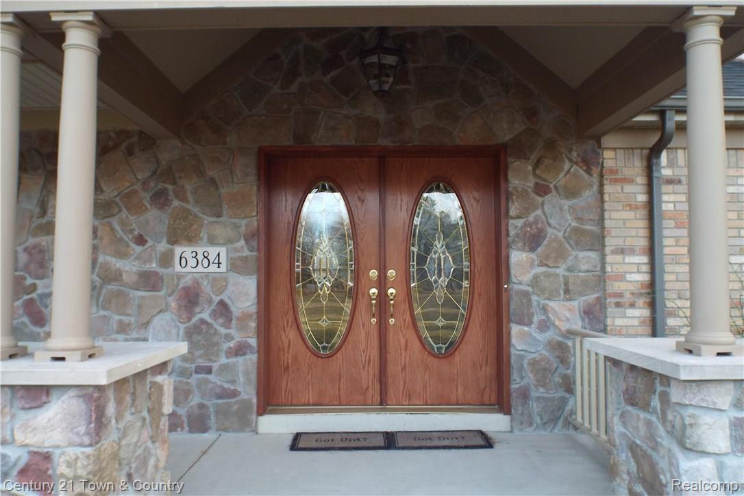 6384 Perry Road Grand Blanc, MI 48439 - Photo 3 of 77 Elegant double wood doors with quality glass workmanship.