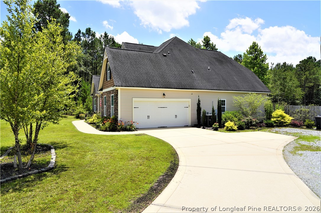 930 Old Vander Road Fayetteville, NC 28312 - Photo 7 of 45 a view of a house with a yard