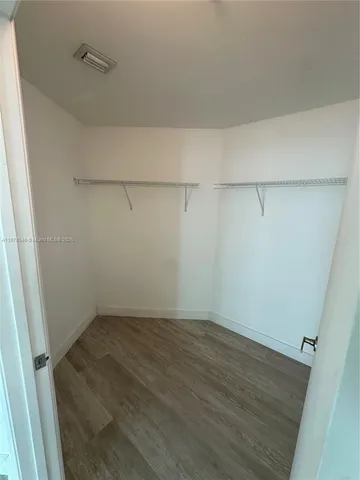 a view of livingroom with hardwood floor and a ceiling fan