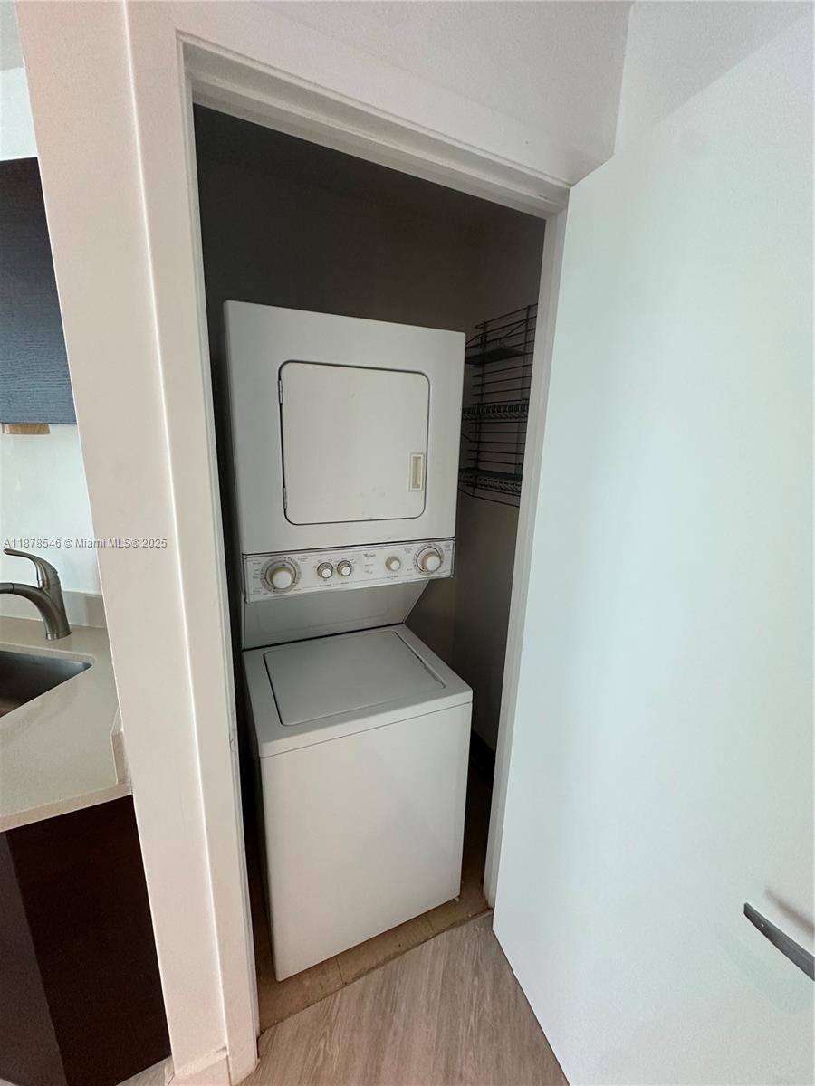 1900 North Bayshore Drive, Unit 2305 Miami, FL 33132 - Photo 7 of 13 a utility room with a washer and dryer