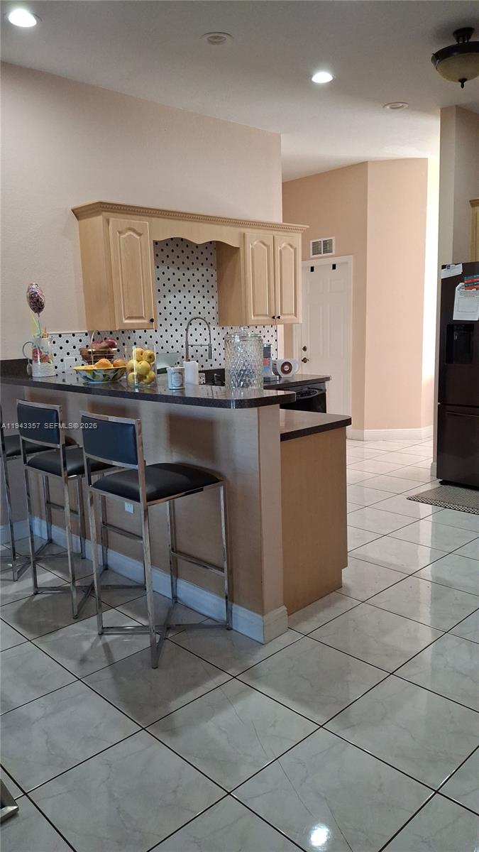 1034 Bayberry Loop Clewiston, FL 33440 - Photo 15 of 38 a kitchen with granite countertop a sink and a stove