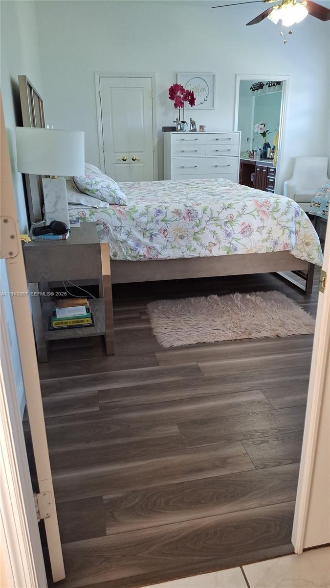 1034 Bayberry Loop Clewiston, FL 33440 - Photo 18 of 38 a bedroom with a bed and a dresser