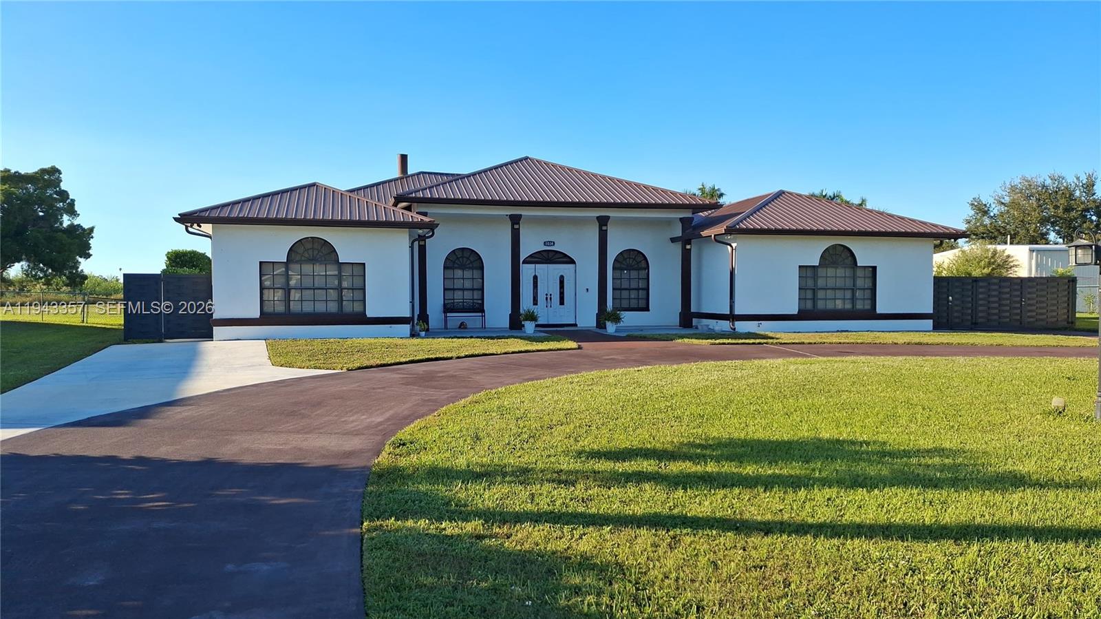 1034 Bayberry Loop Clewiston, FL 33440 - Photo 2 of 38 a view of a house with a swimming pool