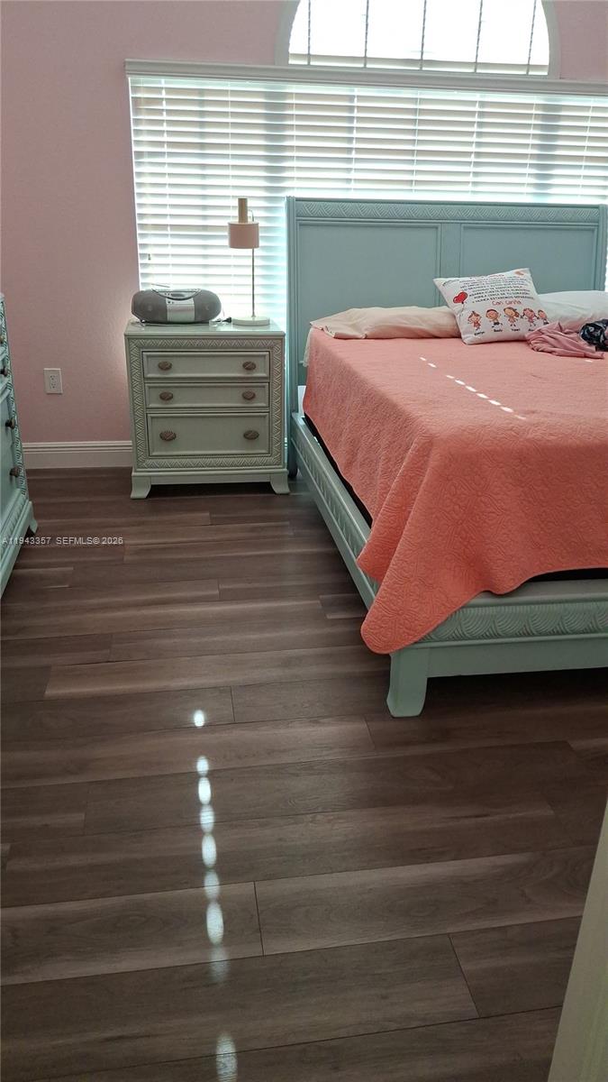 1034 Bayberry Loop Clewiston, FL 33440 - Photo 22 of 38 a room with a bed and window