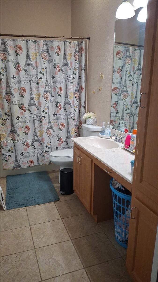 1034 Bayberry Loop Clewiston, FL 33440 - Photo 24 of 38 a bathroom with a sink and a mirror