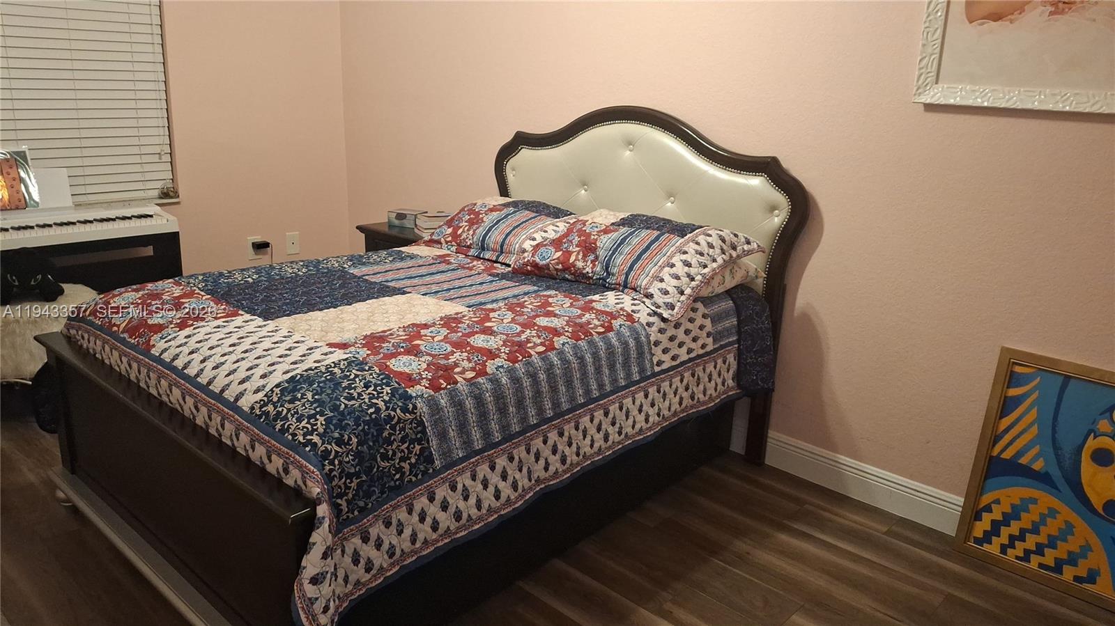 1034 Bayberry Loop Clewiston, FL 33440 - Photo 26 of 38 a bedroom with a bed and a dresser