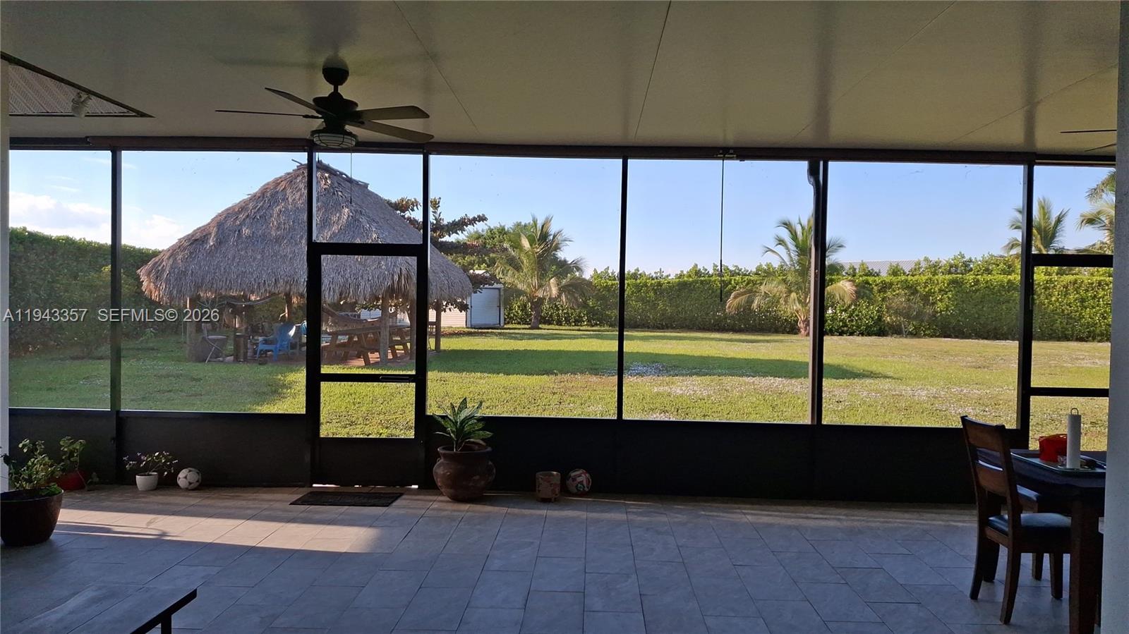 1034 Bayberry Loop Clewiston, FL 33440 - Photo 34 of 38 a view of a porch with furniture and garden