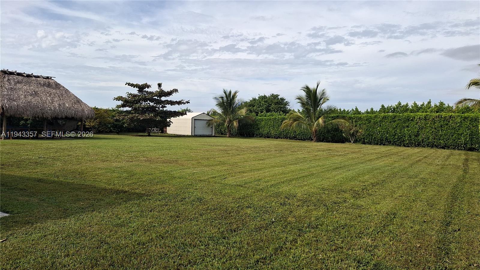 1034 Bayberry Loop Clewiston, FL 33440 - Photo 35 of 38 a view of a outdoor space and a yard