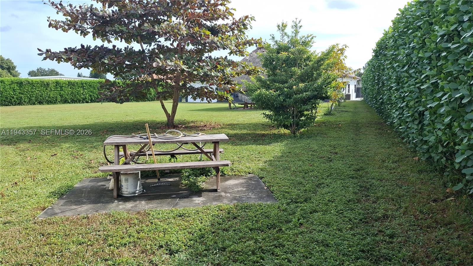 1034 Bayberry Loop Clewiston, FL 33440 - Photo 37 of 38 a bench sitting in the middle of a park