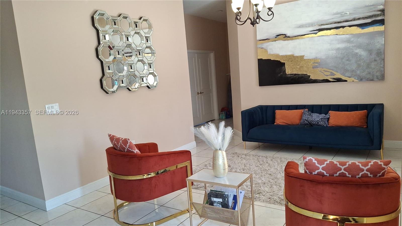 1034 Bayberry Loop Clewiston, FL 33440 - Photo 7 of 38 a living room with furniture and a mirror