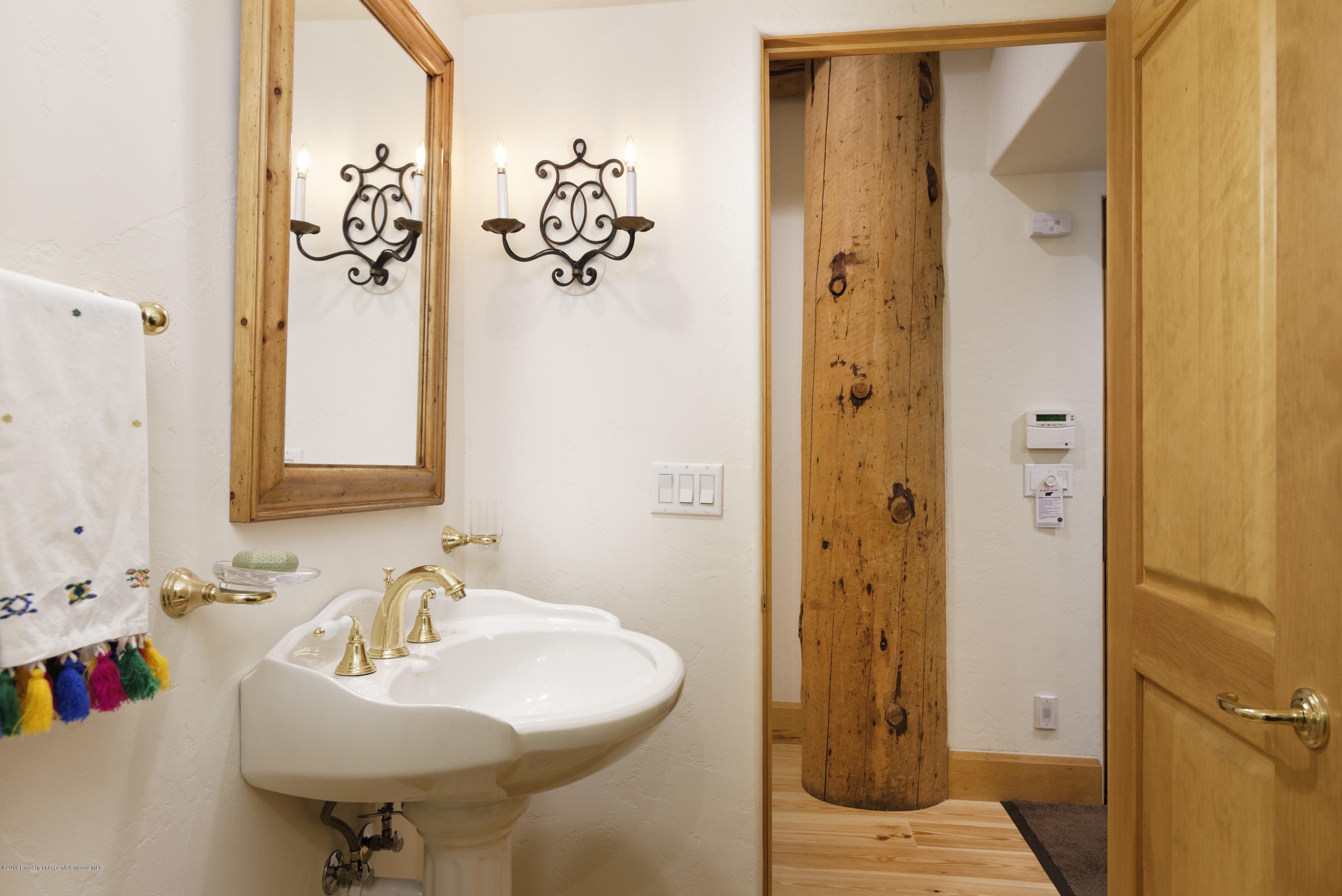 1417 Crystal Lake Road Aspen, CO 81611 - Photo 16 of 36 a bathroom with a sink and a mirror