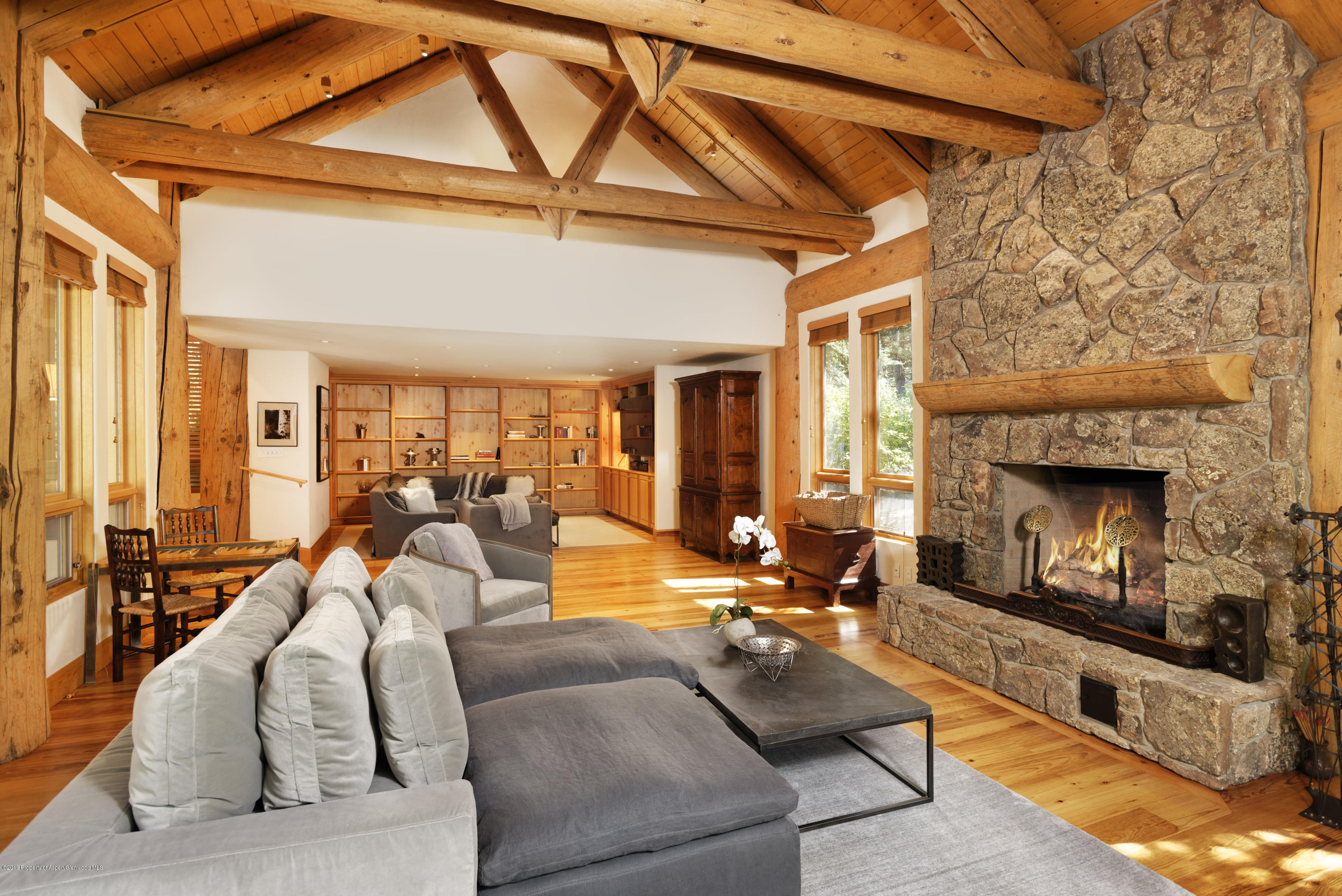 1417 Crystal Lake Road Aspen, CO 81611 - Photo 2 of 36 a living room with furniture and a fireplace