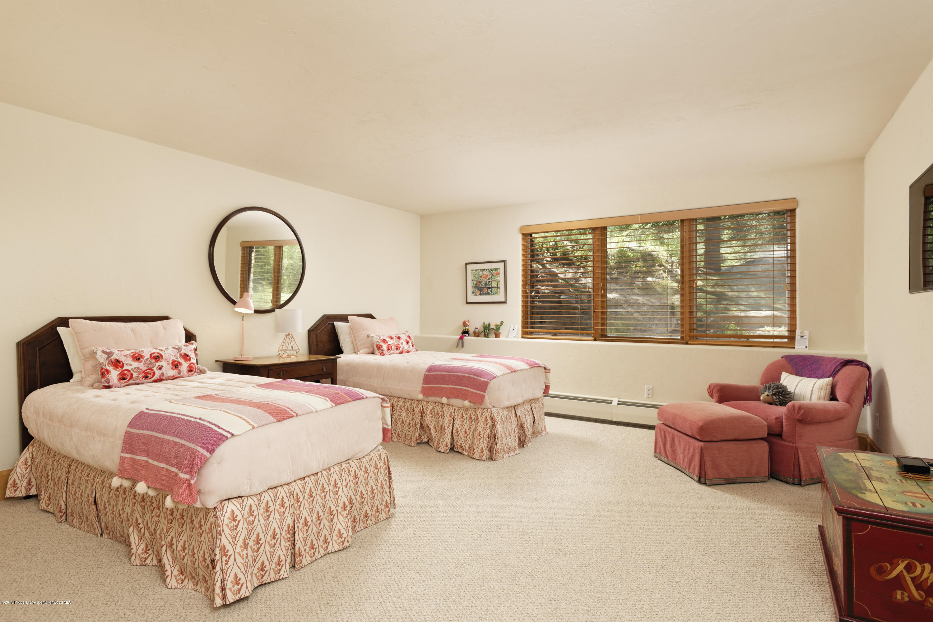 1417 Crystal Lake Road Aspen, CO 81611 - Photo 29 of 36 a bedroom with two beds and a large window