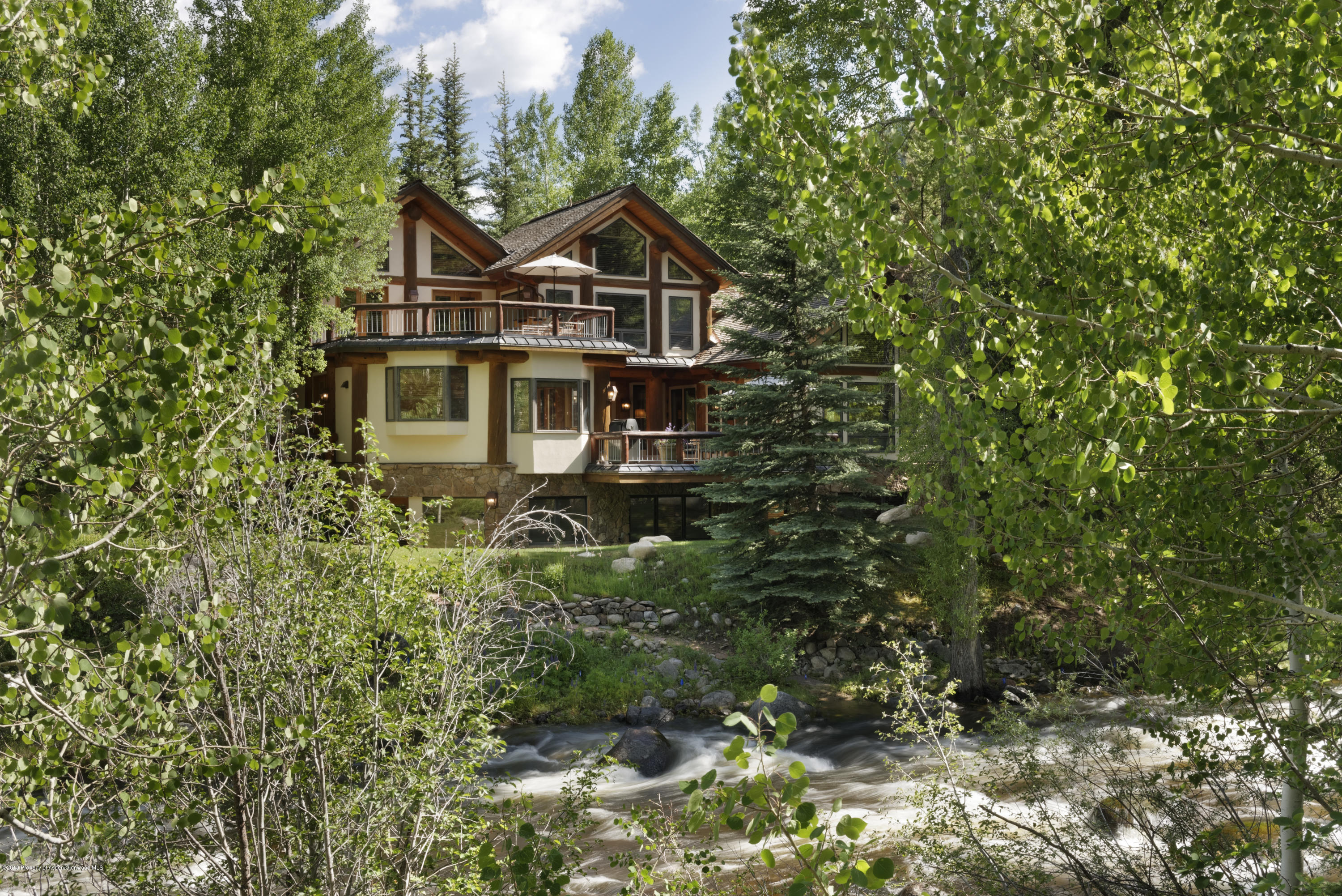 1417 Crystal Lake Road Aspen, CO 81611 - Photo 33 of 36 a front view of a house with a yard
