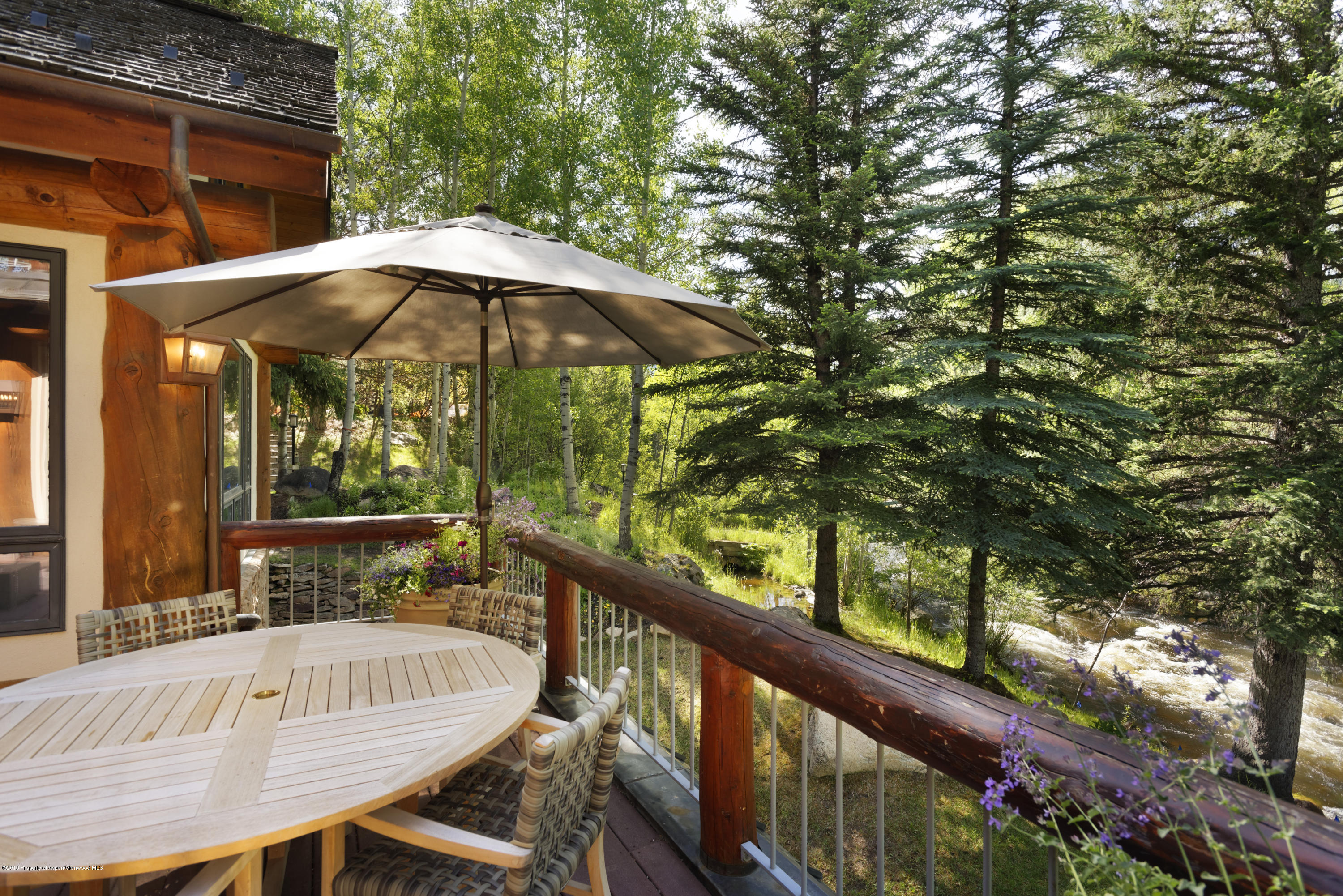 1417 Crystal Lake Road Aspen, CO 81611 - Photo 7 of 36 a view of balcony with furniture and umbrella
