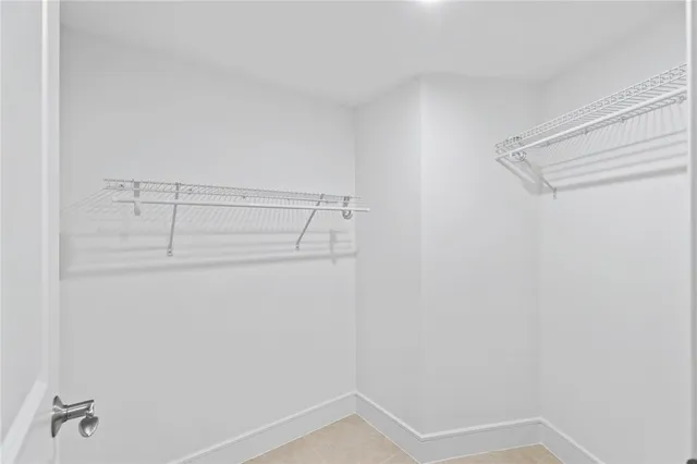 a view of storage and utility room with racks on the wall