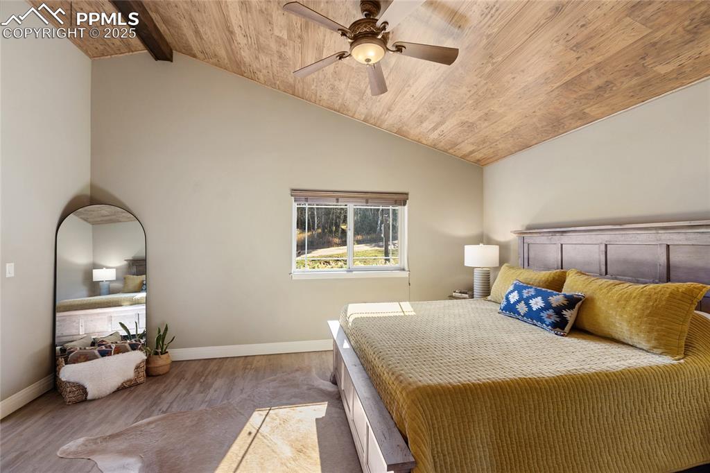 19 Worley Road Divide, CO 80814 - Photo 18 of 31 a bedroom with a bed and a chandelier