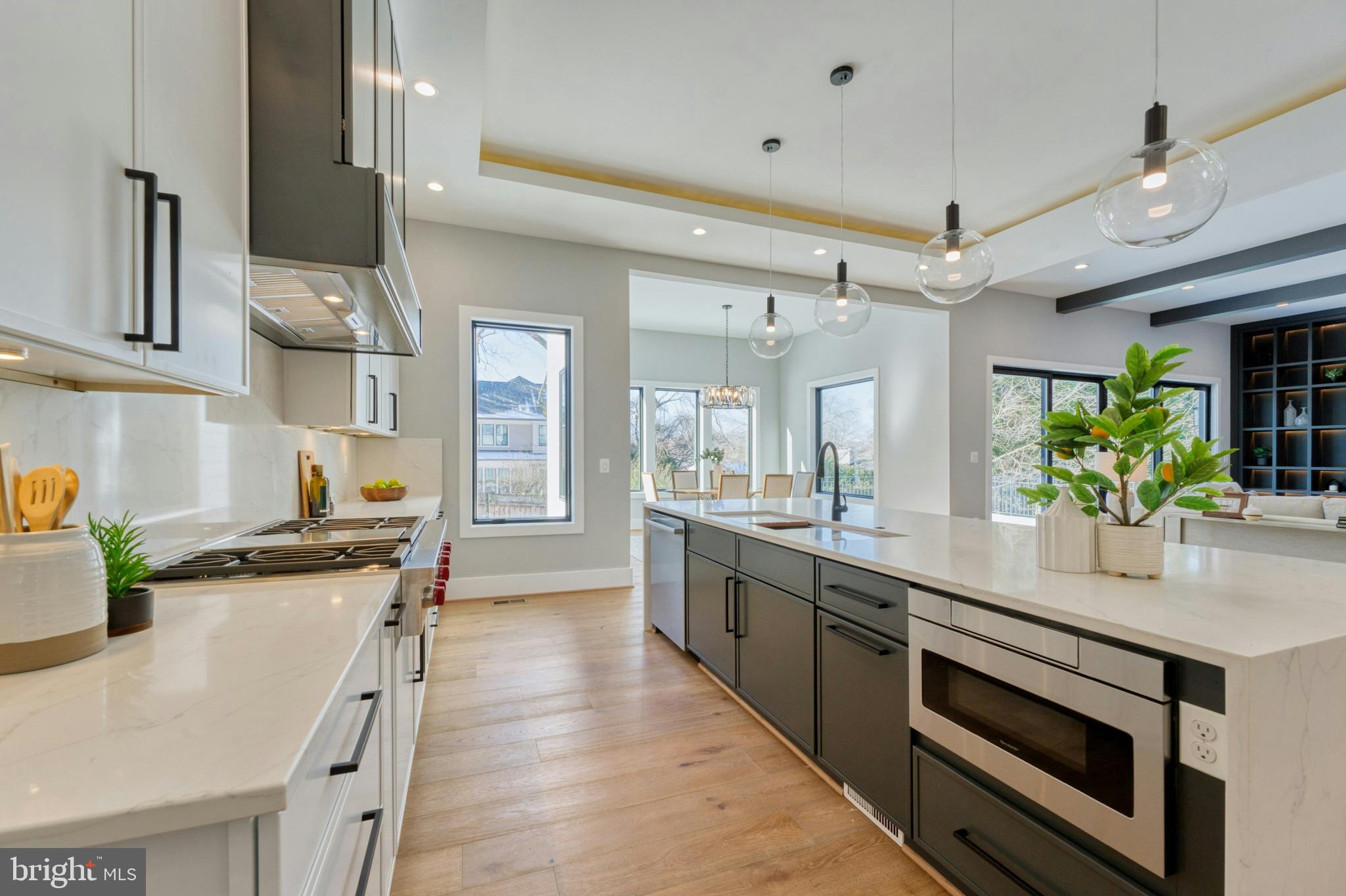 1100 Balls Hill Road McLean, VA 22101 - Photo 13 of 52 a large kitchen with stainless steel appliances a stove a sink dishwasher and cabinets with wooden floor