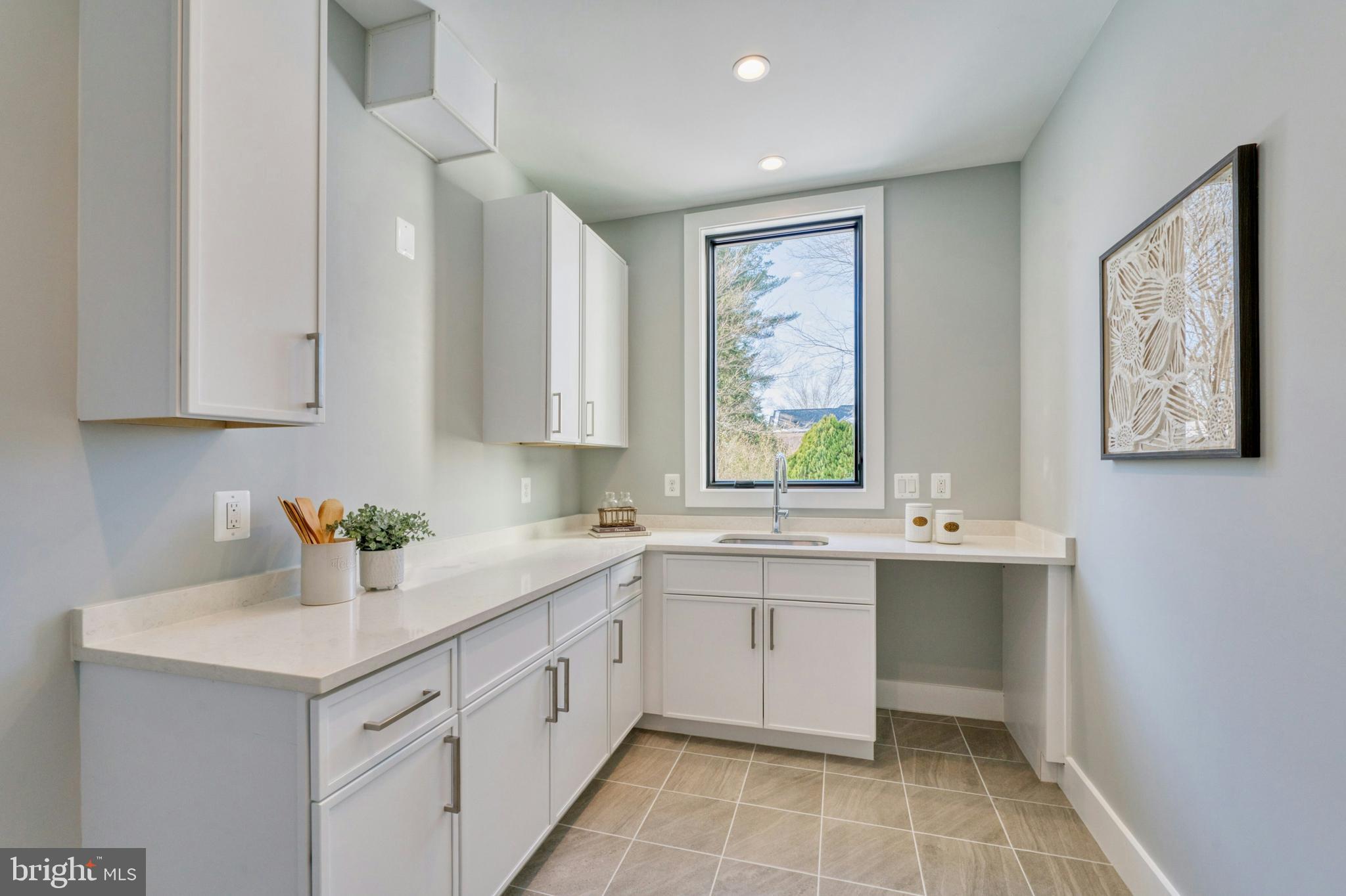 1100 Balls Hill Road McLean, VA 22101 - Photo 16 of 52 a kitchen with a sink and cabinets