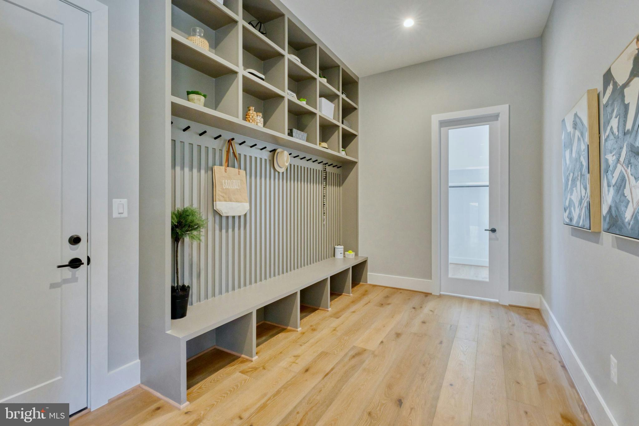 1100 Balls Hill Road McLean, VA 22101 - Photo 19 of 52 a view of staircase with white walls and wooden floor