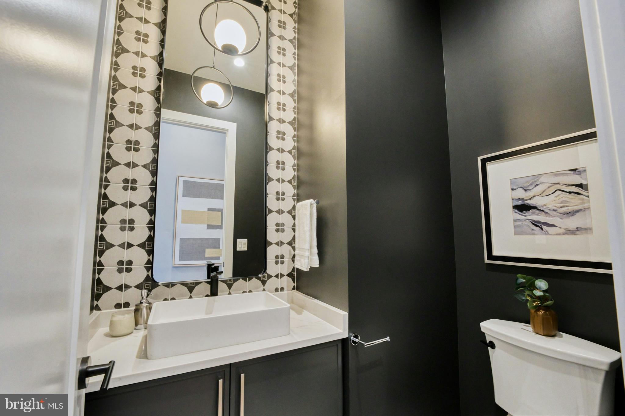 1100 Balls Hill Road McLean, VA 22101 - Photo 20 of 52 a bathroom with a sink and a mirror