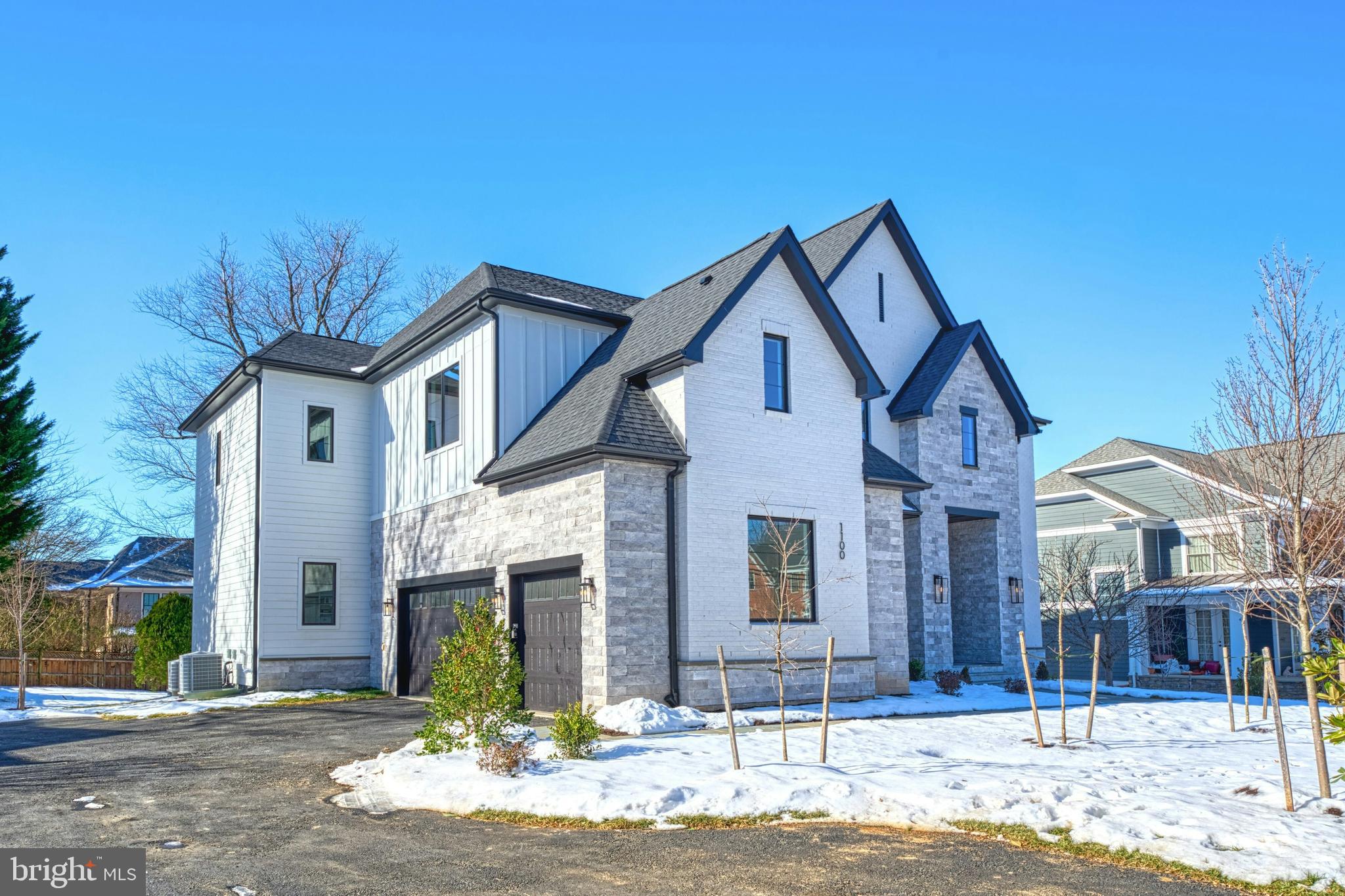 1100 Balls Hill Road McLean, VA 22101 - Photo 2 of 52 a front view of a house with a yard