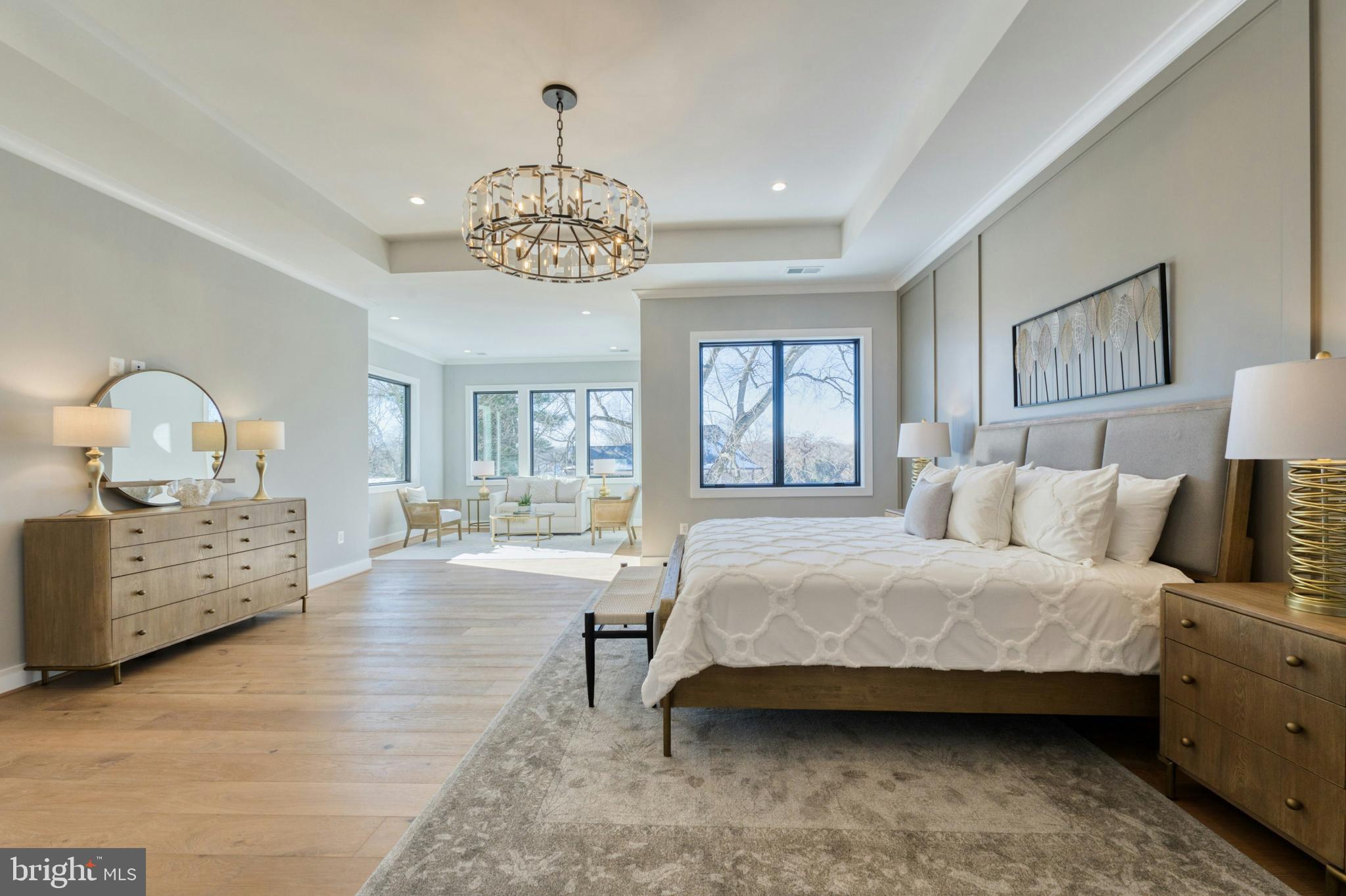 1100 Balls Hill Road McLean, VA 22101 - Photo 22 of 52 a spacious bedroom with a bed chandelier and windows