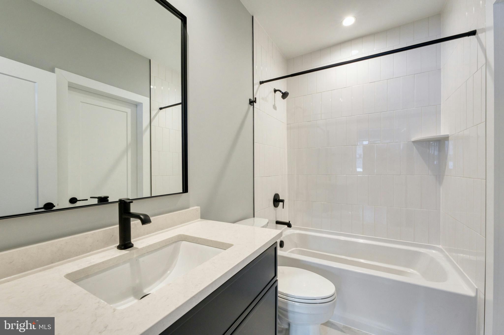 1100 Balls Hill Road McLean, VA 22101 - Photo 31 of 52 a bathroom with a sink a toilet and a mirror