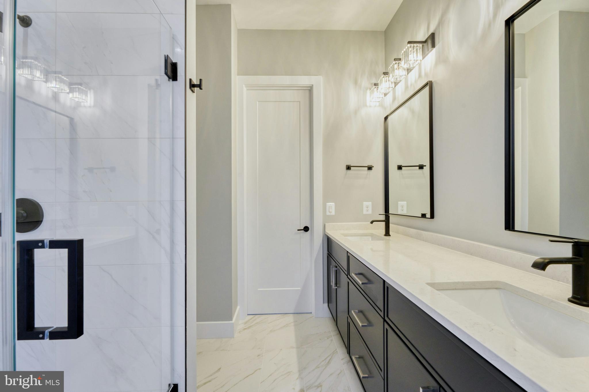 1100 Balls Hill Road McLean, VA 22101 - Photo 41 of 52 a spacious bathroom with a double vanity sink a mirror and shower