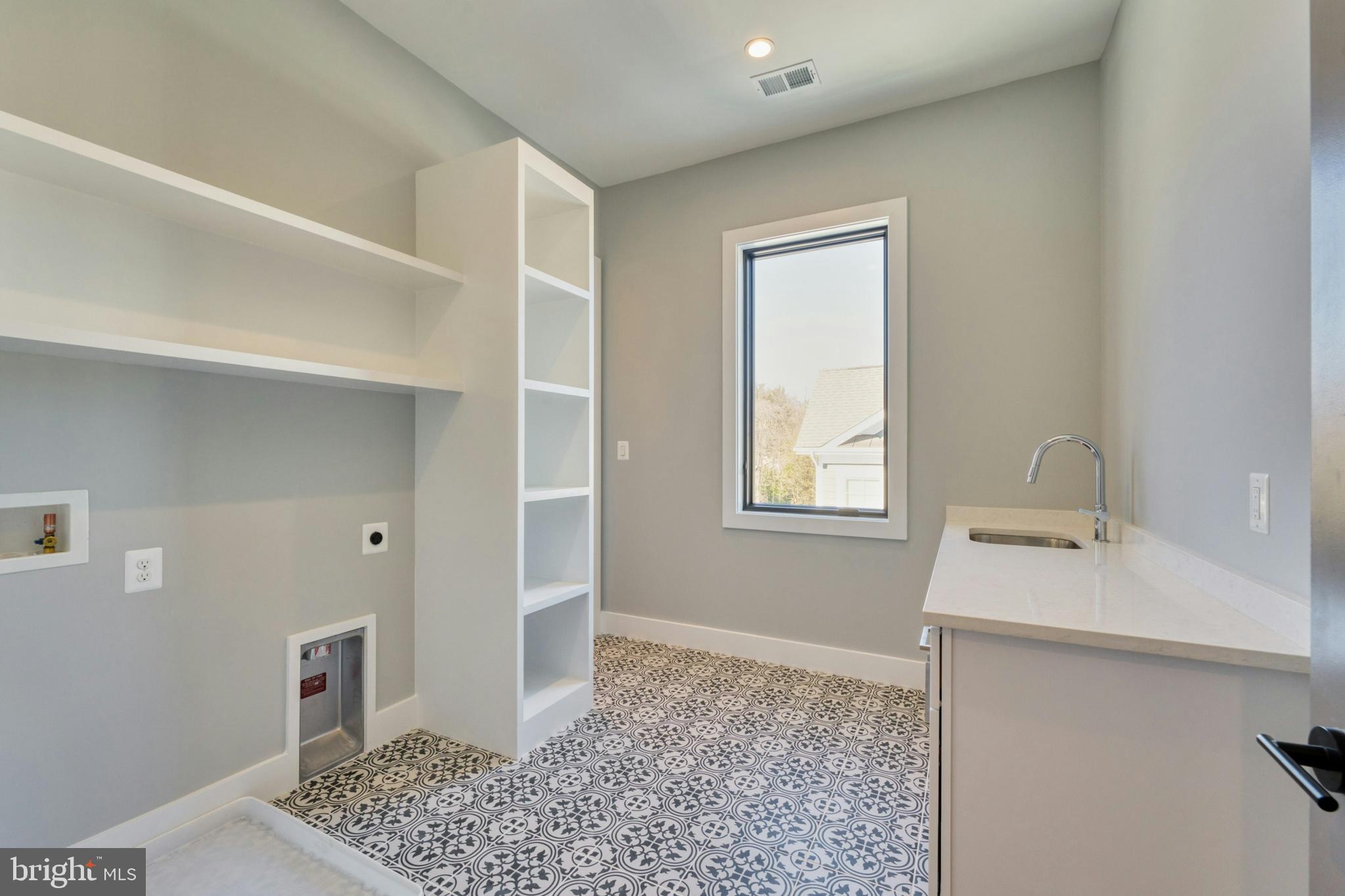 1100 Balls Hill Road McLean, VA 22101 - Photo 45 of 52 a bathroom with a sink and a mirror