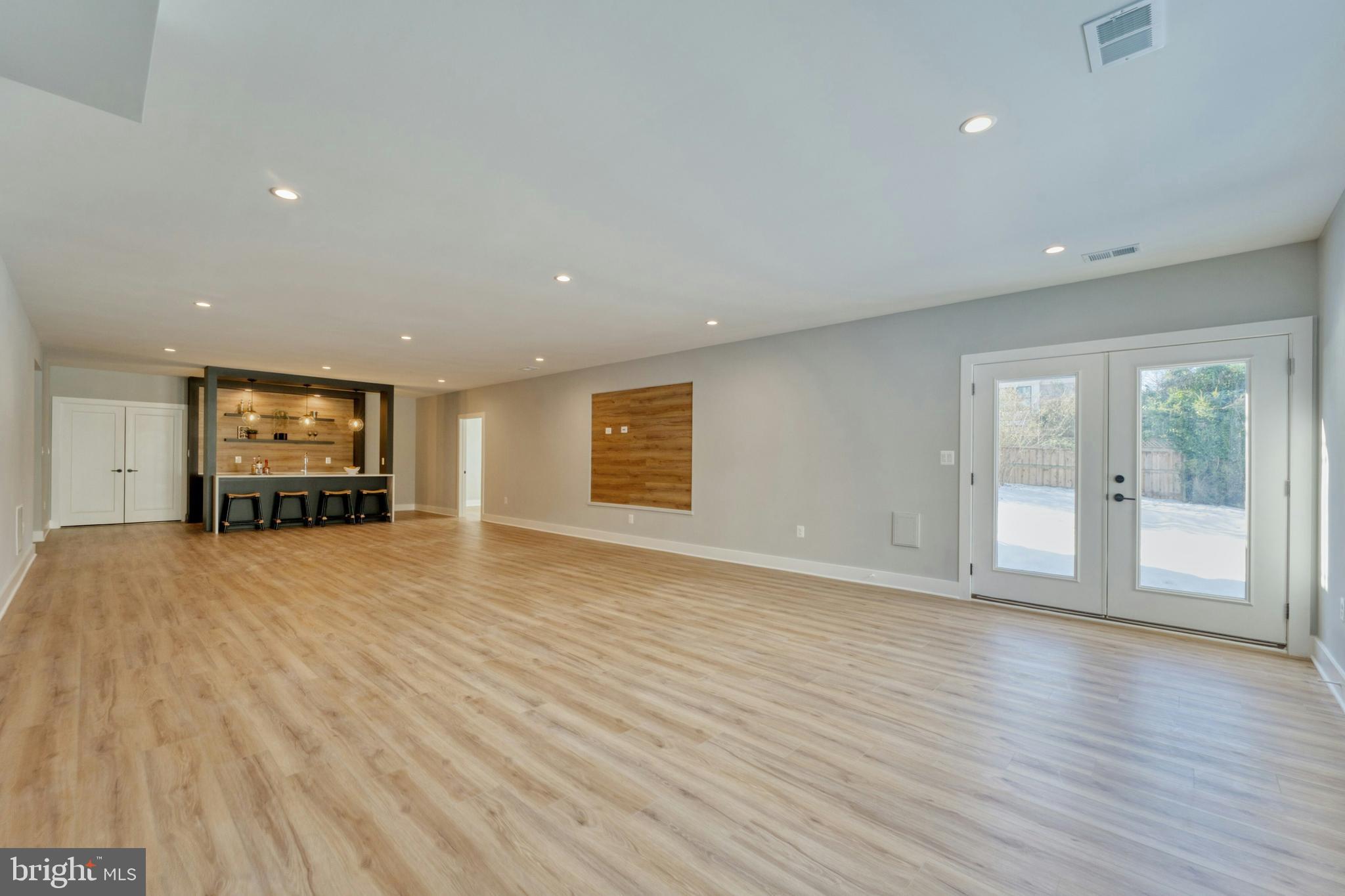 1100 Balls Hill Road McLean, VA 22101 - Photo 47 of 52 a view of an empty room with wooden floor and a window