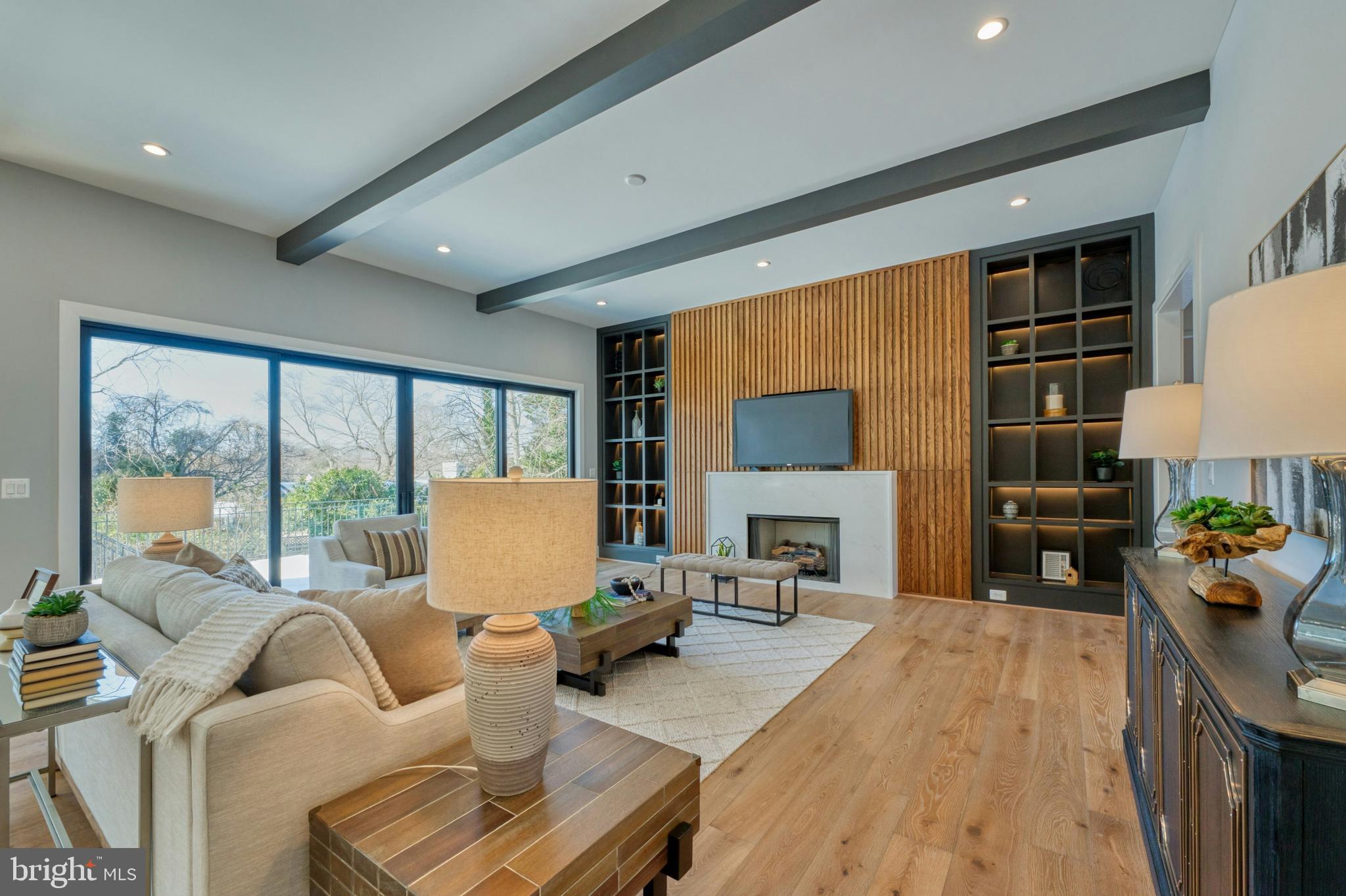 1100 Balls Hill Road McLean, VA 22101 - Photo 7 of 52 a living room with furniture a fireplace and a large window