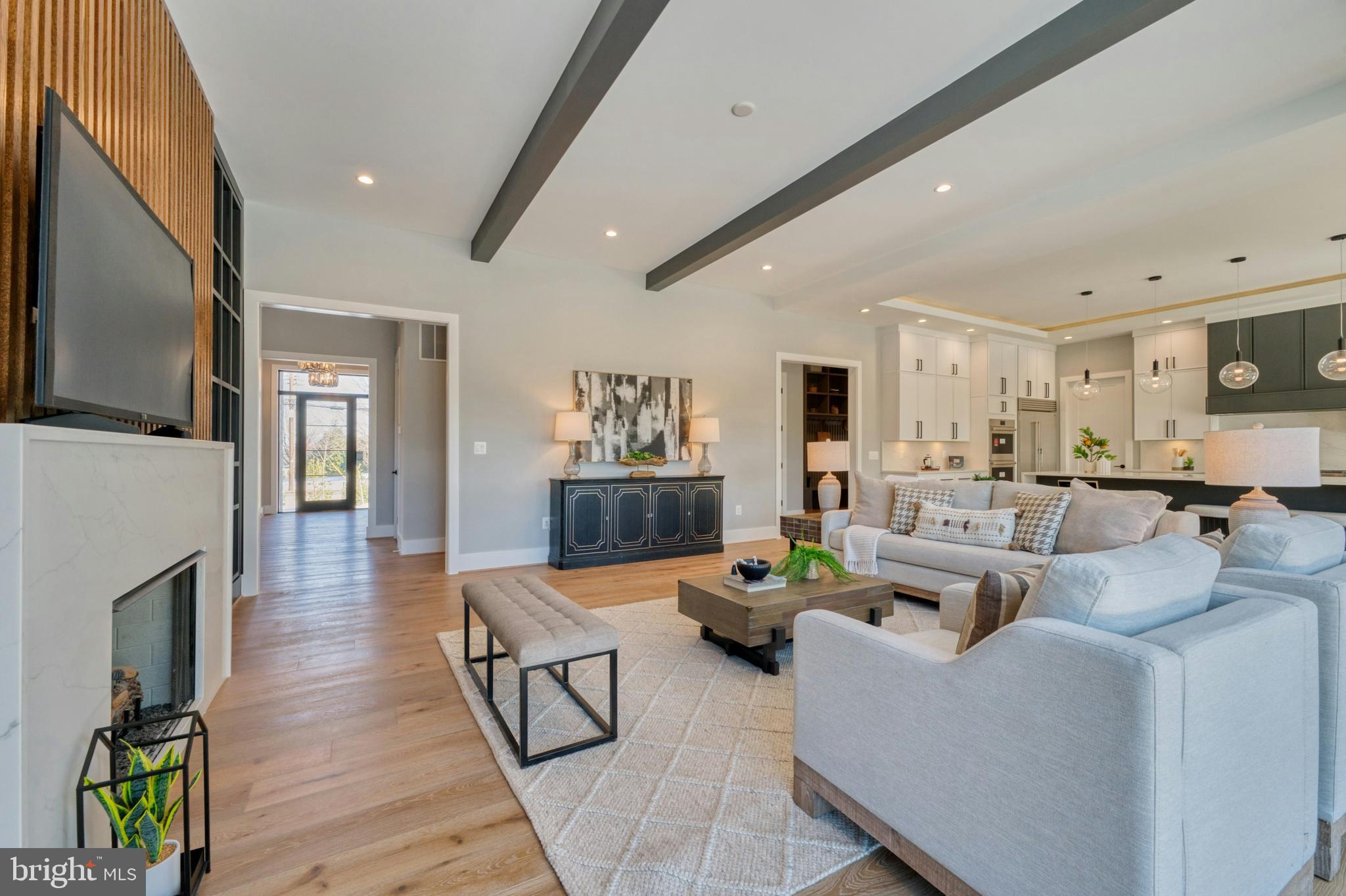 1100 Balls Hill Road McLean, VA 22101 - Photo 9 of 52 a living room with fireplace furniture and a flat screen tv