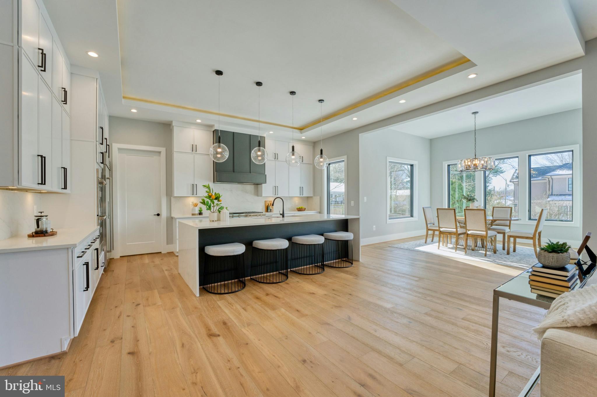 1100 Balls Hill Road McLean, VA 22101 - Photo 10 of 52 a living room with furniture a dining table wooden floor and a large window