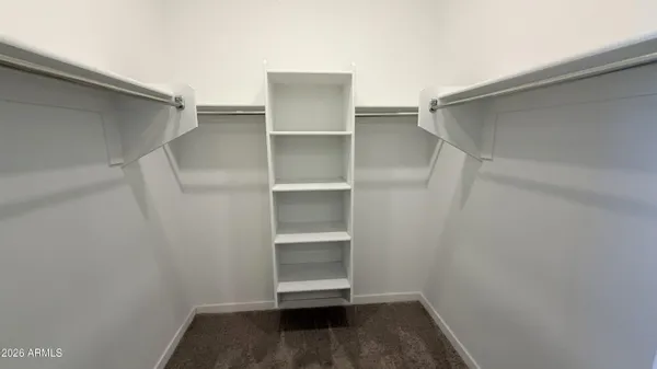 a view of an empty walk in closet
