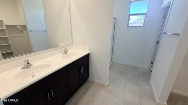 a bathroom with a sink vanity and a mirror