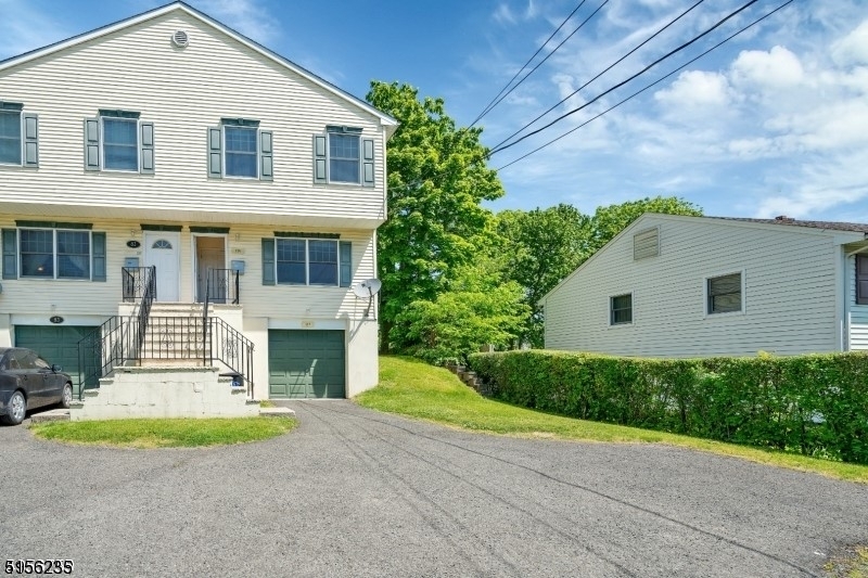 83 Springfield Avenue, Unit A Summit, NJ 07901 - Photo 1 of 14 a view of backyard of house