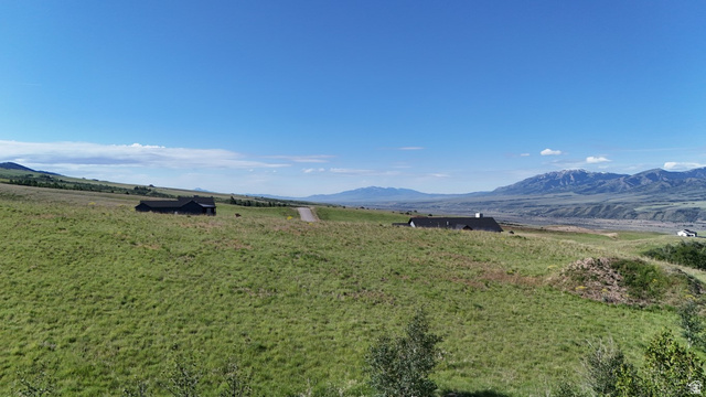 1398 Mogul Lane, Unit 1 Inkom, ID 83245 - Photo 9 of 33 Expansive green terrain featuring distant mountain ranges and a clear sky