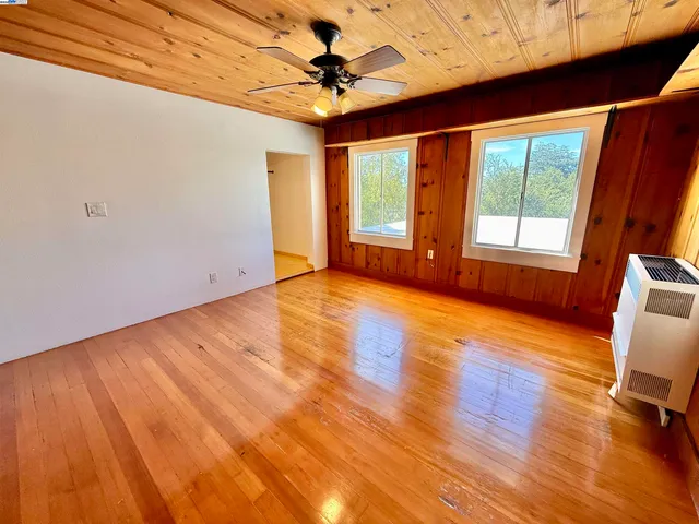 a view of livingroom with hardwood floor and a ceiling fan