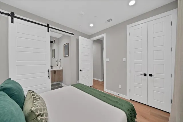 a bedroom with a bed and a shower