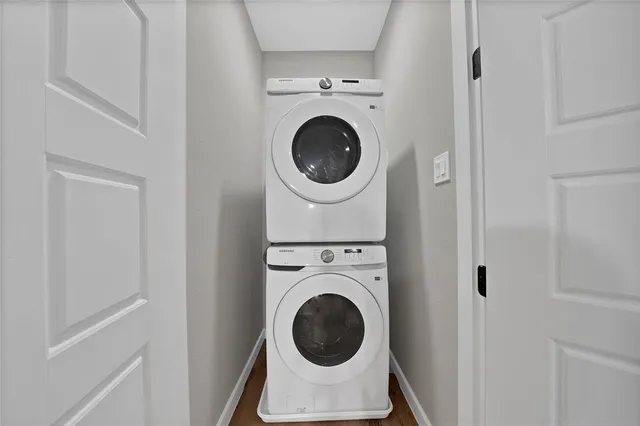 a close view of a utility room with dryer and washer