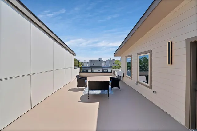 a view of a terrace with furniture and window