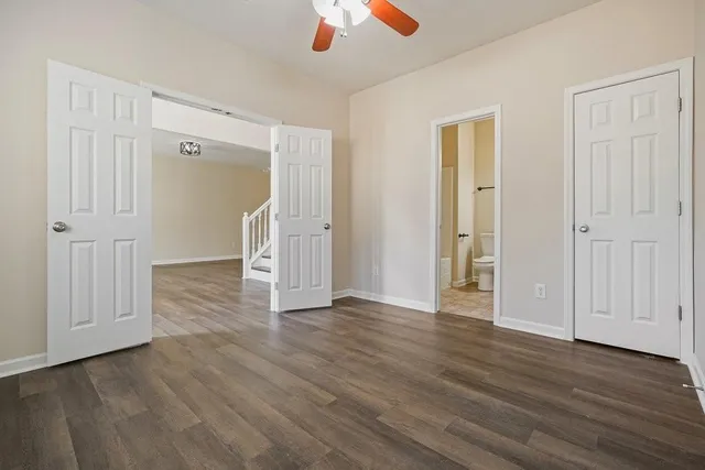 a living room with a bed and furniture