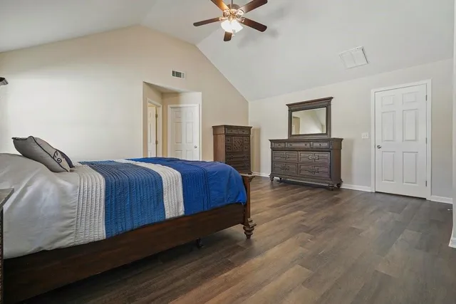 a bathroom with a granite countertop sink and a large mirror