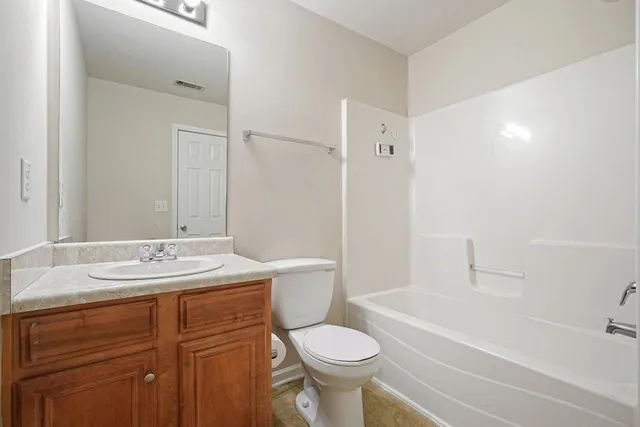 a view of a backyard with large tree