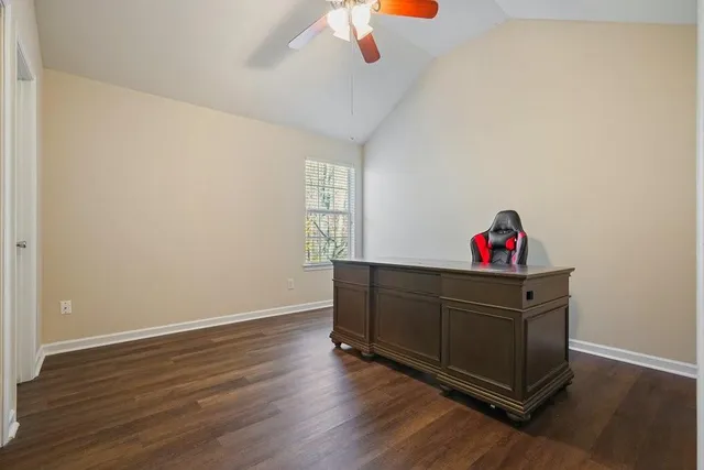 a view of a brick house with large windows