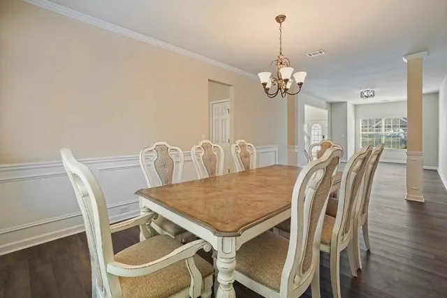 a kitchen with granite countertop a sink stainless steel appliances and cabinets