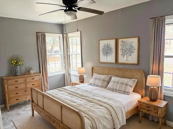 a bedroom with a bed and a window