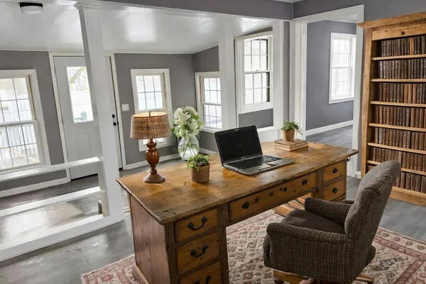 a view of a workspace with furniture and a couch