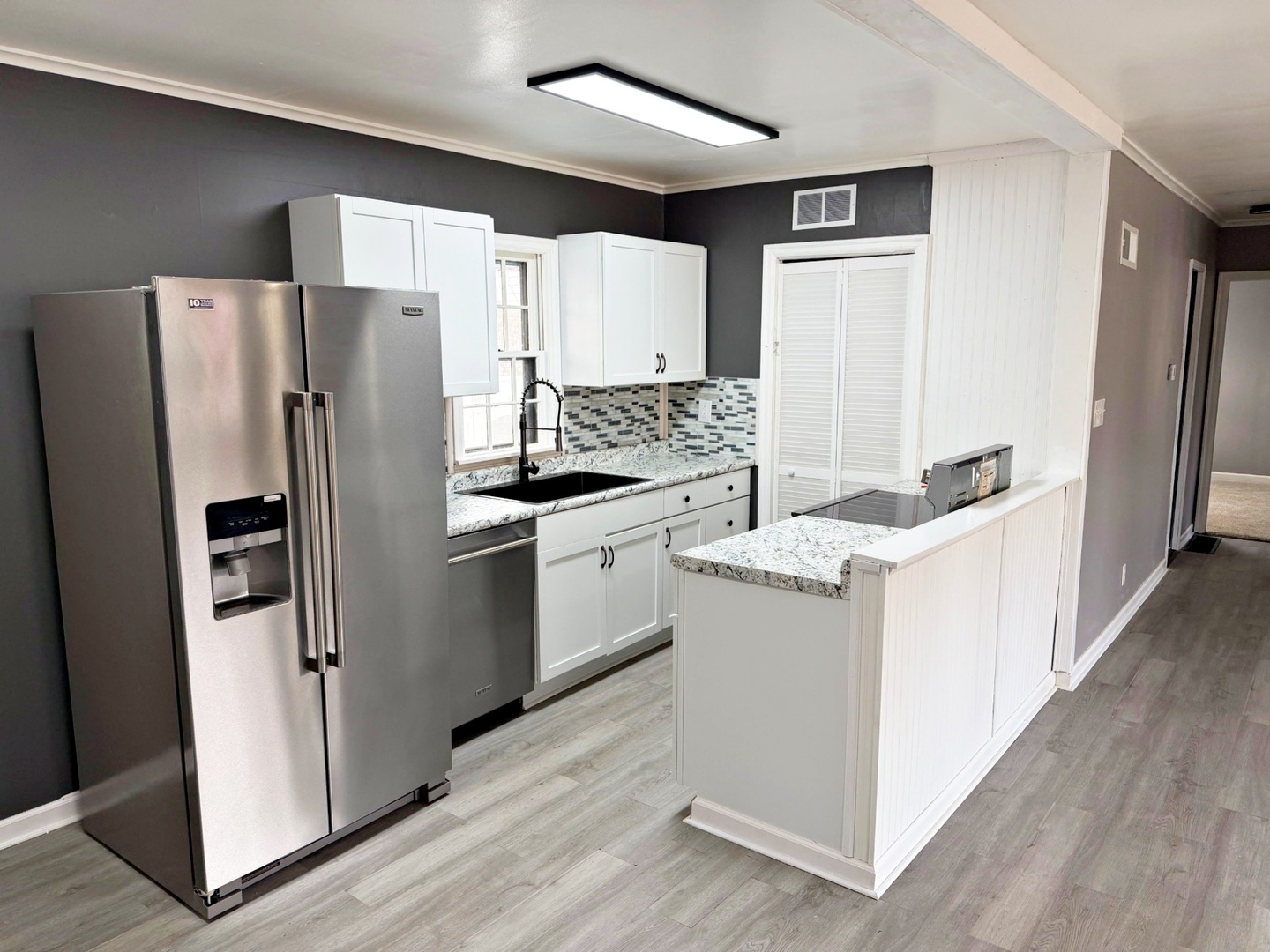 206 East 5th Street Metropolis, IL 62960 - Photo 7 of 33 a kitchen with a refrigerator sink and stove